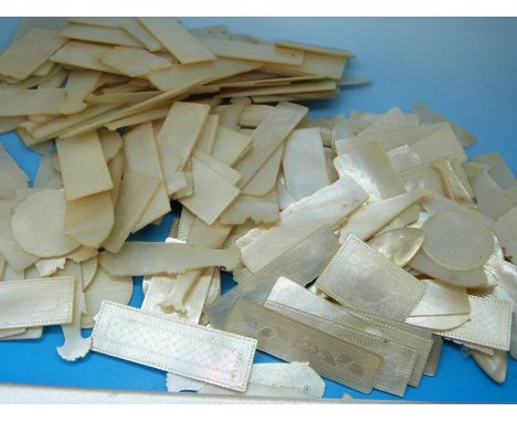 A quantity of Chinese mother of pearl gaming counters including fish (approx 180 in total)