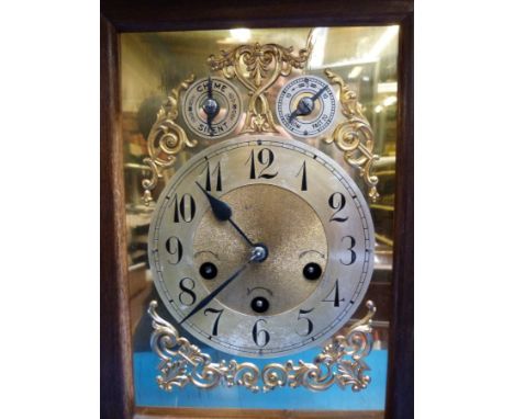 A large walnut cased three train mantel clock with chime/silent and regulator facility, secondary dials 
