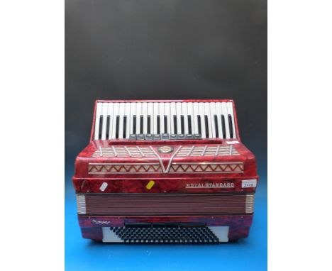 A Royal Standard 120 bass '4 voice' piano accordion , in red pearloid finish (with case)