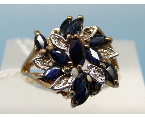 A 9ct gold ring set with sapphires and diamonds in a cluster (size K)