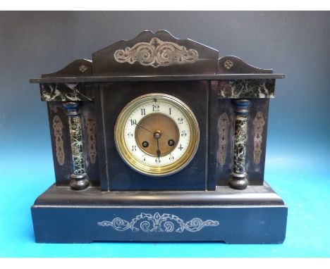 A Victorian slate French mantel clock in Romanesque style case with marbled decoration, the ivory chapter ring with Arabic nu