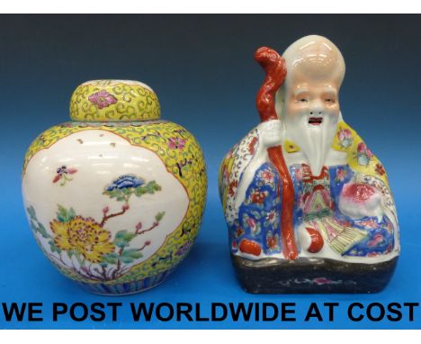 A 20thC Chinese polychrome model of a Shao Lao (24cm tall) together with a ginger jar (20cm tall)
