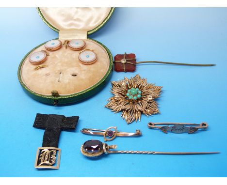 A 9ct gold brooch in the form of a flower set with turquoise to the centre,a 9ct gold brooch set with an amethyst, a brooch e