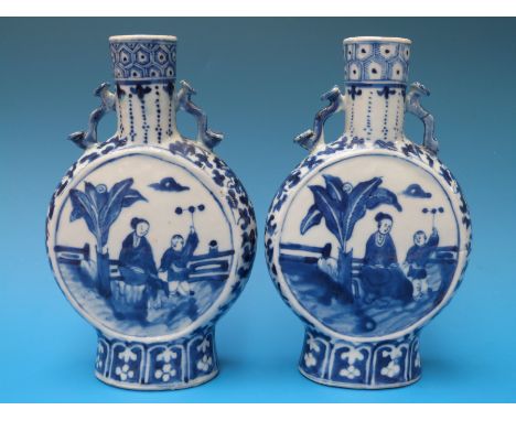 A pair of 19thC Chinese blue and white moon flasks decorated with court scenes and four character Kangxi mark to base (approx