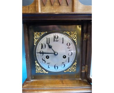 A mahogany cased mantel clock