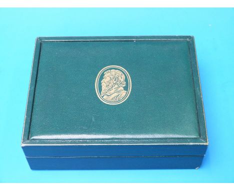 A vintage Rolex box together with a stainless steel bracelet for a Rolex Daytona, a Rolex buckle, the bezel insert and hands 