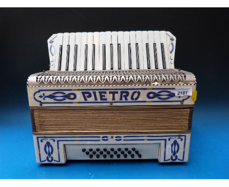 A Pietro 24 bass piano accordion, in ivory and blue finish (with case)