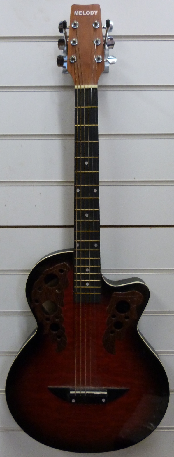 A round back "Melody" model 3822 acoustic guitar in flame finish