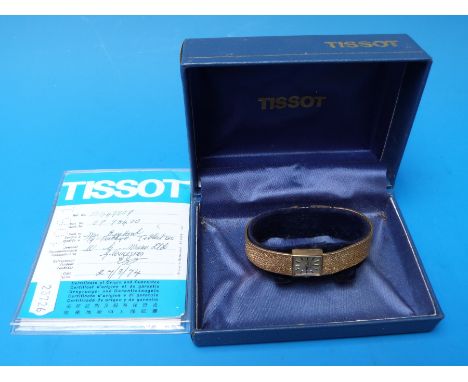 A boxed 9ct gold ladies Tissot watch marked 375 to strap