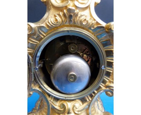 A gilt brass French mantel clock in Louis IV style striking on a bell