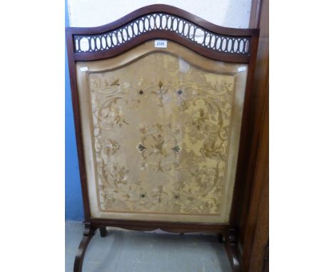 A 19thC silk embroidered fire screen with pierced decoration to top, width 61cm 