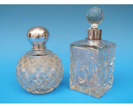 A hallmarked silver mounted globe shaped dressing table bottle and a white metal mounted square example