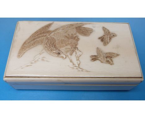 A rectangular ivory box decorated with an eagle hunting smaller birds 