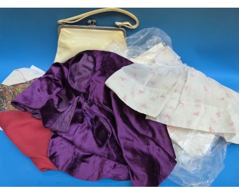 A collection of vintage textiles to include lace, dresses, children's clothing, embroidered shawl etc