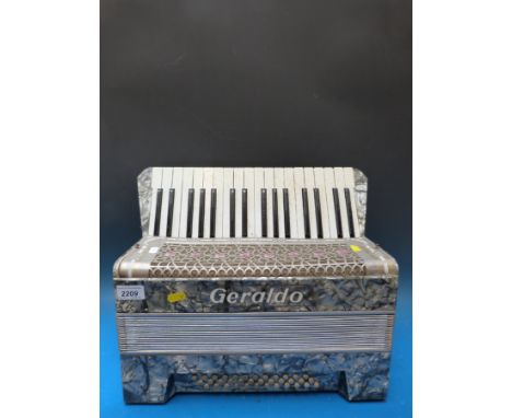 A 1930s Geraldo 36 bass piano accordion, in grey pearloid finish 