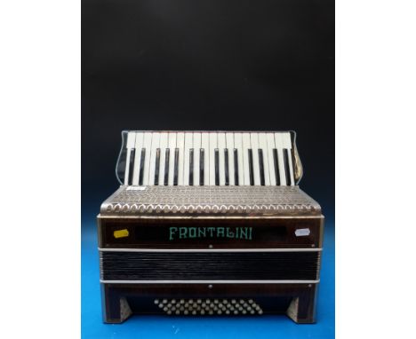 A Frontalini 48 bass c1940s piano accordion, in wood grain finish case inlaid with Tunbridge ware style banding decoration (n