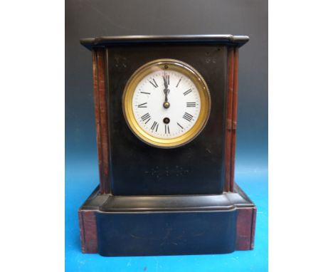 A Victorian slate mantel timepiece with red marble decoration to case, the white enamelled dial with Roman numerals, beetle a