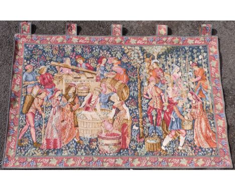 A Flemish style tapestry with traditional wine making scene