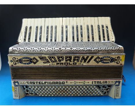 A 120 bass Paolo Soprani piano accordion in decorated ivory finish by Castelfidada, oynx effect to sharps 