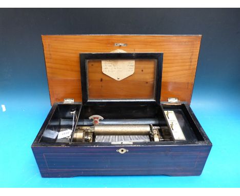 A late 19th century cylinder music box playing six airs with tune indicator, repeat mechanism and stop/start control, serial 