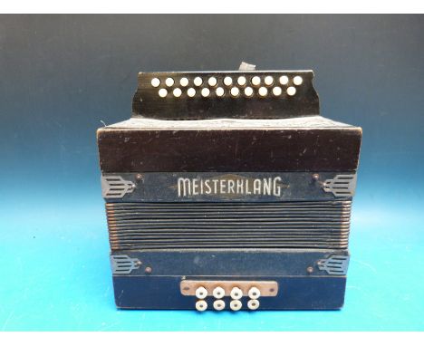 A vintage two row melodeon with name plate Ferdinand Moser, Dusseldorf 'Meisterklang' in C/F with eight bass buttons, in dark