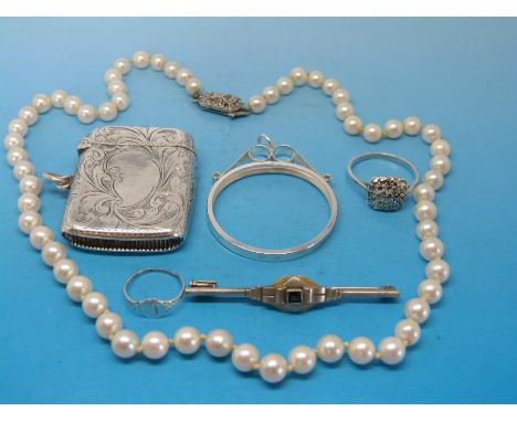 A single strand pearl necklace with hallmarked silver clasp, a hallmarked silver vesta case, silver ring, silver mount and a 