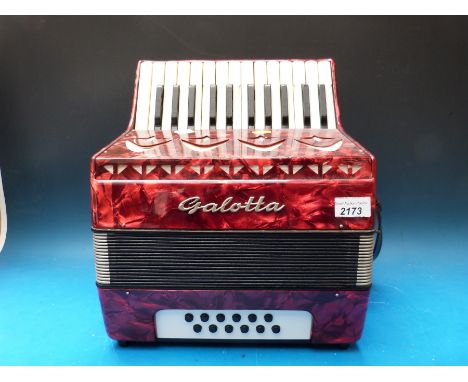 A 1990s Galotta 12 bass childs or students piano accordion, in red pearloid finish with case