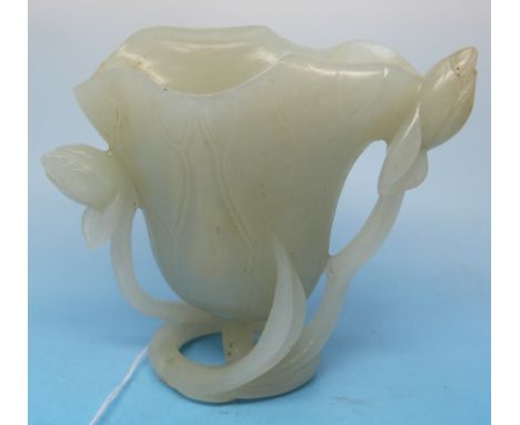 A pale celadon jade vase carved in the form of a lotus flower (height 7.6cm)