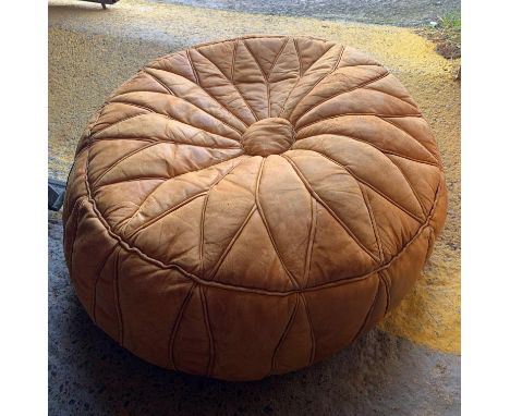 A LEATHER POUFFE