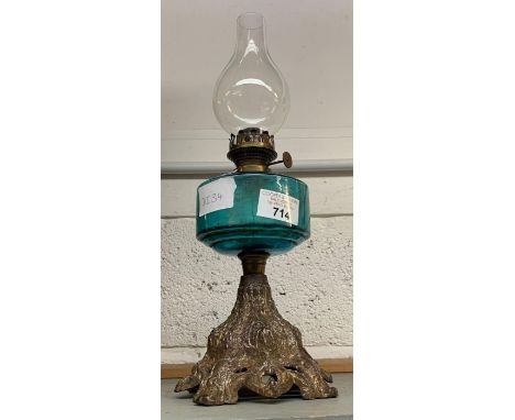 20TH CENTURY OIL LAMP WITH TURQUOISE GLASS RESERVOIR ON METAL BASE