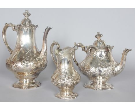 A VICTORIAN THREE PIECE TEA SET by THE BARNARDS, comprising teapot, coffee pot and milk jug. London 1848 and 1850.  Makers: E