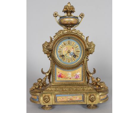 A GOOD 19TH CENTURY FRENCH GILT AND ORMOLU MANTLE CLOCK, with Sevres dial and panels, eight-day movement, the centre surmount