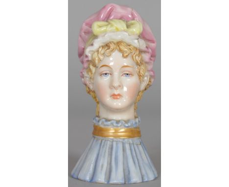 A ROYAL WORCESTER CANDLE SNUFFER (with crack). 3.25 ins high.