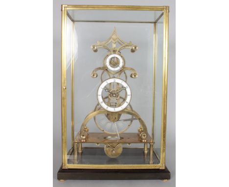 A BRASS SKELETON CLOCK, 20TH CENTURY, with circular enamel dial and subsidiary seconds dial, housed in a glass case. Clock 1f