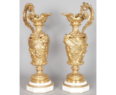 A GOOD LARGE PAIR OF ORMOLU AND MARBLE EWER SHAPE LAMP BASES, of classical form, decorated with putti harvesting grapes on an