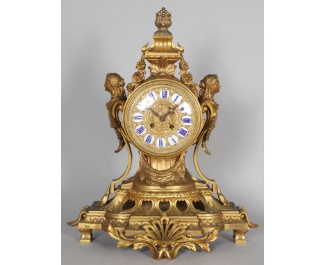 A GOOD LARGE 19TH CENTURY FRENCH ORMOLU MANTLE CLOCK, with eight-day movement, the circular dial inset with white and blue en