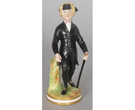 A DERBY PORCELAIN FIGURE OF DR SYNTAX carrying a stick, on a circular base. 6.5ins high.