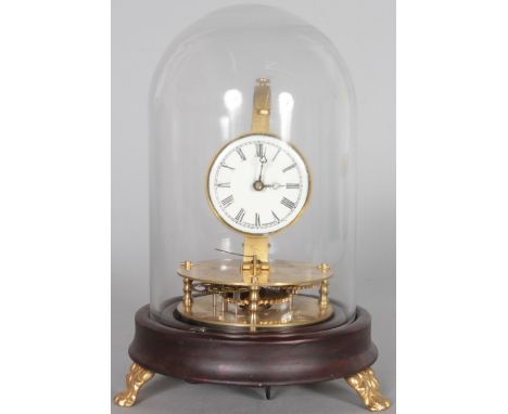 A BRIGGS STYLE ROTARY PENDULUM CLOCK, white enamel dial, under a glass dome. 9ins high.