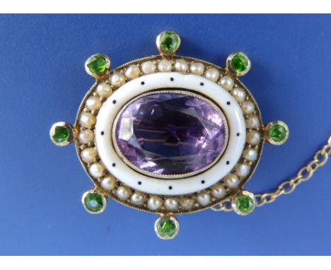 A small 9c Suffragette brooch set with amethyst &amp; peridot and white enamel, 1" across.