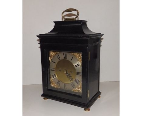 An 18thC ebonised bracket clock, the twin fusee movement with anchor escapement and bell striking, 15" high overall.