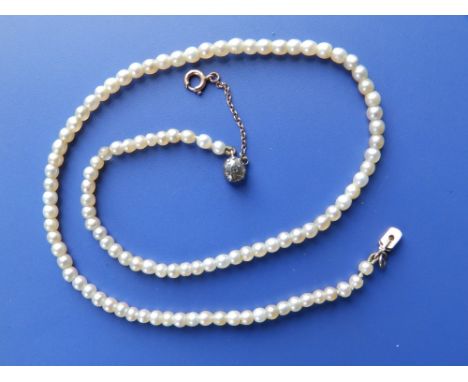 A small old pearl necklace with single colourless stone clasp, the pearls approximately 3.5mm diameter,  13".