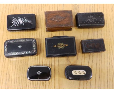 Seven 19thC papier mache snuff boxes and a wooden box. (8)