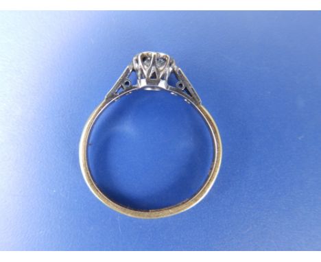 A diamond illusion set solitaire. Weighing approximately 0.30 carat, with small diamonds to shoulders in '18ct' &amp; 'Pt'.  