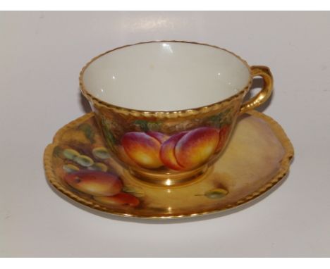 A Royal Worcester porcelain teacup painted fruit by C. Bowen and a saucer by J. Smith - C55. (2)