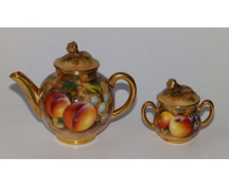 A miniature Royal Worcester fruit painted teapot, 4" across and a two-handled covered sugar basin. 2.25" across. (2)