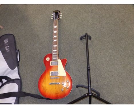 A Ridgewood electric guitar with stand.