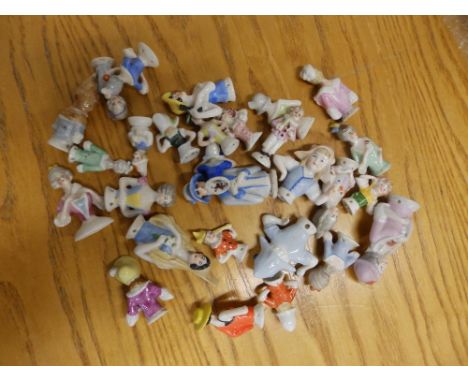 A large collection of small pin cushion/half dolls.