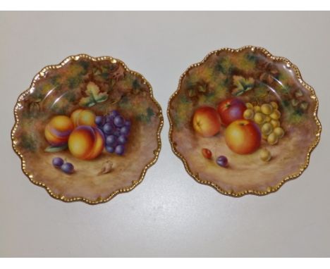 A pair of Royal Worcester fruit painted dessert plates by H. Ayrton with gilded fluted rims, 9". (2)