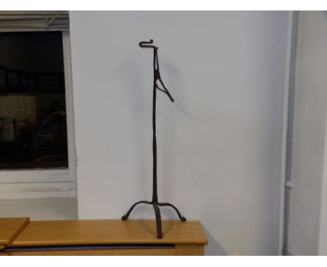 An 18thC rush light holder, 26" high.