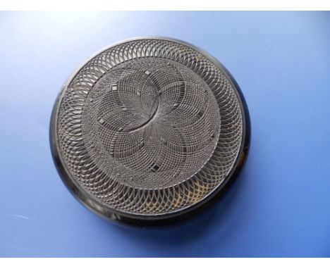A small engine turned lignum vitae circular snuff box - 'Made from a beam taken from the old Glasgow Cathedral'.